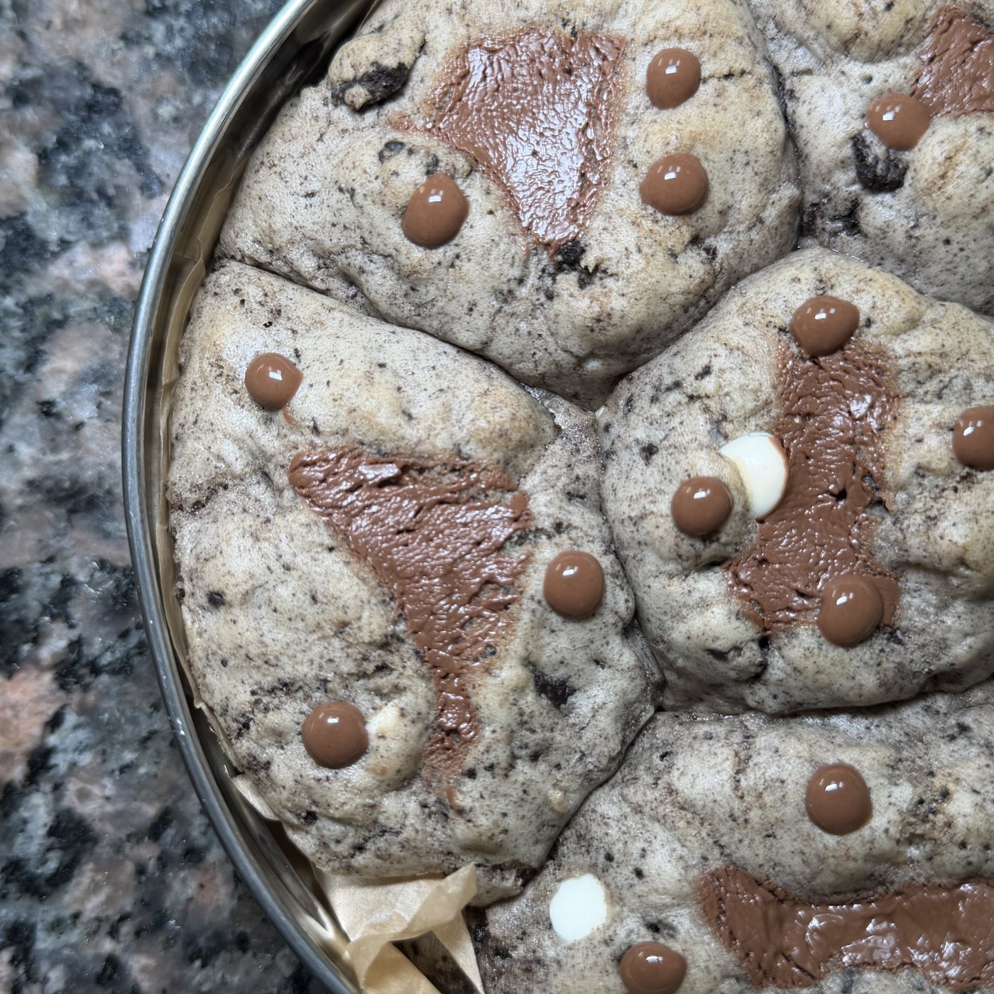 Cookies & Cream Cookie close-up — crushed cookies and melted chocolate